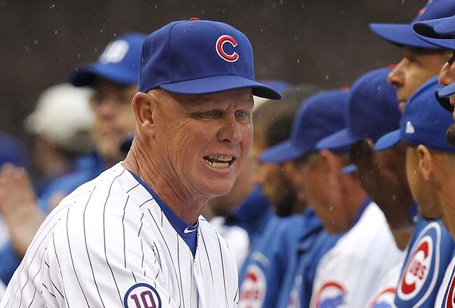 CHICAGO, IL - APRIL 01:  Mike Quade Manager of the Chicago Cubs shakes hands with his players during introductions prior to playing the Pittsburgh Pirates on opening day at Wrigley Field on April 1, 2011 in Chicago, Illinois. Pittsburgh won the game 6-3. (Photo by Gregory Shamus/Getty Images)