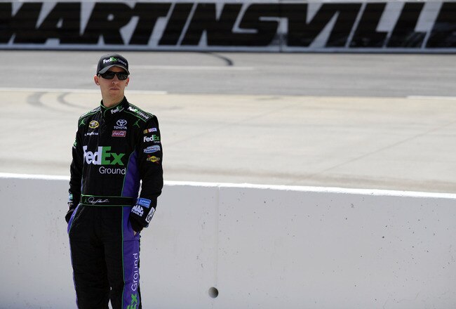 MARTINSVILLE, VA - APRIL 02:  Denny Hamlin, driver of the #11 FedEx Ground Toyota, stands on the grid during qualifying for the NASCAR Sprint Cup Series Goody's Fast Relief 500 at Martinsville Speedway on April 2, 2011 in Martinsville, Virginia.  (Photo by Jared C. Tilton/Getty Images for NASCAR)