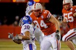 LINCOLN, NE - NOVEMBER 13: Jared Crick #94 and Baker Steinkuhler #55 of the Nebraska Cornhuskers run down D.J. Beshears #20 of the Kansas Jayhawks during first half action of their game at Memorial Stadium on November 13, 2010 in Lincoln, Nebraska.  (Photo by Eric Francis/Getty Images)