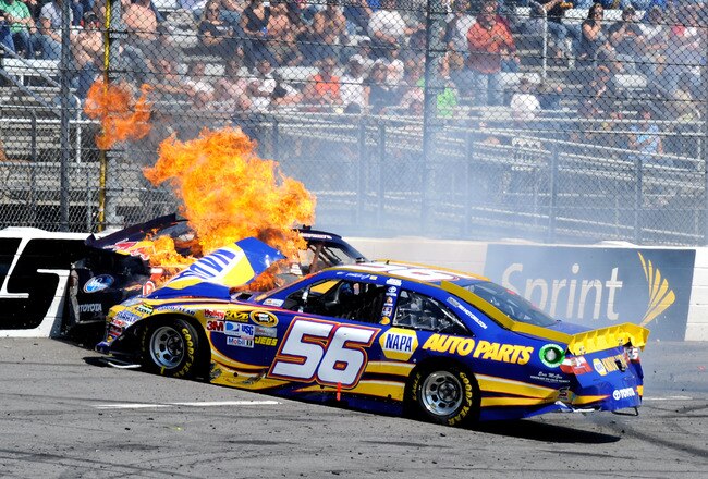 MARTINSVILLE, VA - APRIL 03:  The #56 NAPA Auto Parts Toyota, driven by Martin Truex Jr., catches fire after an incident with Kasey Kahne, driver of the #4 Red Bull Toyota, during the NASCAR Sprint Cup Series Goody's Fast Relief 500 at Martinsville Speedway on April 3, 2011 in Martinsville, Virginia.  (Photo by John Harrelson/Getty Images for NASCAR)