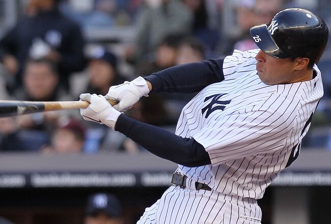 NEW YORK, NY - APRIL 02:  Mark Teixeira #25 of the New York Yankees hits 3 RBI home run against the Detroit Tigers at Yankee Stadium on April 2, 2011 in the Bronx borough of New York City.  (Photo by Nick Laham/Getty Images)