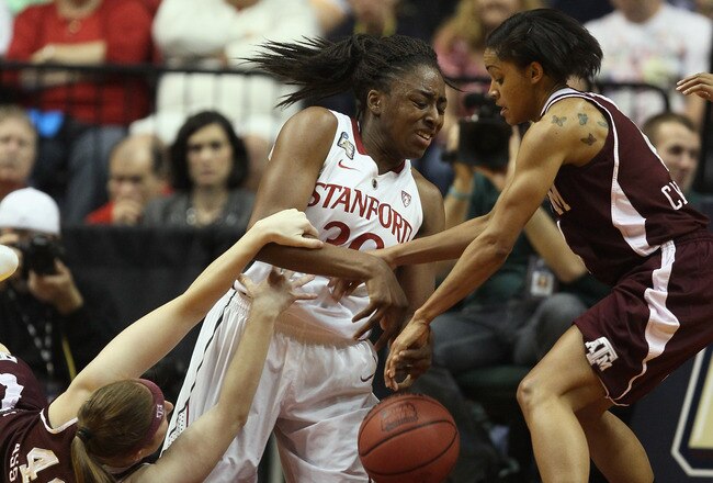 INDIANAPOLIS, IN - APRIL 03:  Nnemkadi Ogwumike #30 of the Stanford Cardinal tries to grab the loose ball before Sydney Carter #4 and Kelsey Assarian #40 of the Texas A&M Aggies during the semifinals of the 2011 NCAA Women's Final Four on April 3, 2011 at Conseco Fieldhouse in Indianapolis, Indiana.  (Photo by Elsa/Getty Images)