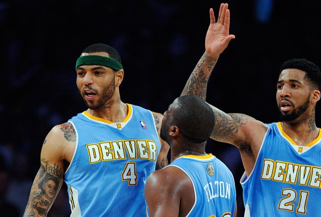 LOS ANGELES, CA - APRIL 03:  Kenyon Martin #4 of the Denver Nuggets celebrates with teammates Raymond Felton #20 and Wilson Chandler #21 after scoring a basket against the Los Angeles Lakers during the NBA basketball game at Staples Center on April 3, 2011 in Los Angeles, California. NOTE TO USER: User expressly acknowledges and agrees that, by downloading and or using this photograph, User is consenting to the terms and conditions of the Getty Images License Agreement.  (Photo by Kevork Djansezian/Getty Images)