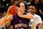 INDIANAPOLIS - MARCH 12:  Center Luka Mirkovic #12 of the Northwestern Wildcats looks to pass against the Purdue Boilermakers during their quarterfinal game in the Big Ten Men's Basketball Tournament at Conseco Fieldhouse on March 12, 2010 in Indianapolis, Indiana.  (Photo by Jonathan Daniel/Getty Images)