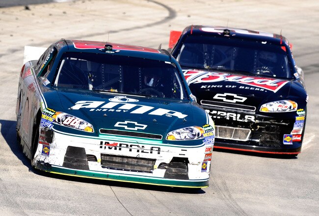 MARTINSVILLE, VA - APRIL 03:  Dale Earnhardt Jr., driver of the #88 Amp Energy/National Guard Chevrolet, leads Kevin Harvick, driver of the #29 Budweiser Chevrolet, during the NASCAR Sprint Cup Series Goody's Fast Relief 500 at Martinsville Speedway on April 3, 2011 in Martinsville, Virginia.  (Photo by John Harrelson/Getty Images for NASCAR)