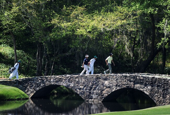 AUGUSTA, GA - APRIL 04:  Hiroyuki Fujita (L) and Ryo Ishikawa of Japan cross the Nelson Bridge with their caddies during a practice round prior to the 2011 Masters Tournament at Augusta National Golf Club on April 4, 2011 in Augusta, Georgia.  (Photo by Harry How/Getty Images)