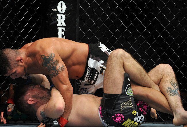 LOS ANGELES, CA - OCTOBER 24:  UFC fighter Joe Stevenson (top) battles with UFC fighter Spencer Fisher (bottom) during their Lightweight bout at UFC 104: Machida vs. Shogun at Staples Center on October 24, 2009 in Los Angeles, California.  (Photo by Jon Kopaloff/Getty Images)