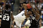 HOUSTON, TX - APRIL 04:  Kemba Walker #15 of the Connecticut Huskies fights for the ball agianst Shelvin Mack #1 of the Butler Bulldogs during the National Championship Game of the 2011 NCAA Division I Men's Basketball Tournament at Reliant Stadium on April 4, 2011 in Houston, Texas.  (Photo by Streeter Lecka/Getty Images)