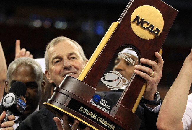 HOUSTON, TX - APRIL 04:  Head coach Jim Calhoun of the Connecticut Huskies celebrate with his team and the trophy after defeating the Butler Bulldogs to win the National Championship Game of the 2011 NCAA Division I Men's Basketball Tournament by a score of 53-41 at Reliant Stadium on April 4, 2011 in Houston, Texas.  (Photo by Streeter Lecka/Getty Images)