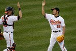 BALTIMORE, MD - APRIL 04: Catcher Matt Wieters #32 of the Baltimore Orioles and reliever Koji Uehara #19 celebrate after the Orioles defeated the Detroit Tigers 5-1 during opening day at Oriole Park at Camden Yards on April 4, 2011 in Baltimore, Maryland.  (Photo by Rob Carr/Getty Images)