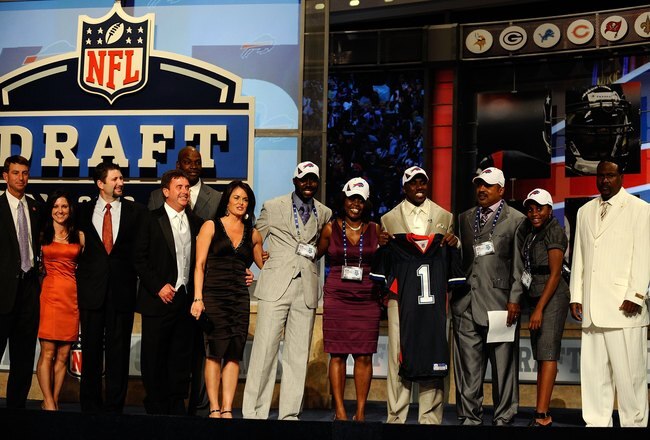 NEW YORK - APRIL 22:  C.J. Spiller from the Clemson Tigers holds up a Buffalo Bills jersey as he poses with friends and family after he was selected number 9 overall by the Bills during the first round of the 2010 NFL Draft at Radio City Music Hall on April 22, 2010 in New York City.  (Photo by Jeff Zelevansky/Getty Images)