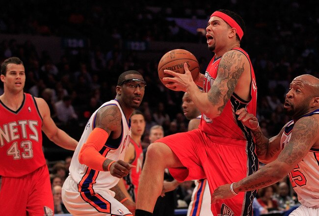 NEW YORK, NY - MARCH 30:  Deron Williams #8 of the New Jersey Nets drives against Anthony Carter#25 of the New York Knicks at Madison Square Garden on March 30, 2011 in New York City. NOTE TO USER: User expressly acknowledges and agrees that, by downloading and/or using this Photograph, User is consenting to the terms and conditions of the Getty Images License Agreement. The Knicks defeated the Nets 120-116.  (Photo by Chris Trotman/Getty Images)