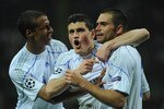 MILAN, ITALY - APRIL 05:  Edu (R) of Schalke 04 celebrates with his team mates after scoring during the UEFA Champions League Quarter Final match between FC Internazionale Milano and Schalke 04 at San Siro Stadium on April 5, 2011 in Milan, Italy.  (Photo by Valerio Pennicino/Getty Images)