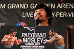 NEW YORK, NY - FEBRUARY 14:  Manny Pacquiao addresses the media at a press conference to promote his upcoming fight with Shane Mosley at The Lighthouse at Chelsea Piers on February 14, 2011 in New York City.  (Photo by Chris Trotman/Getty Images)