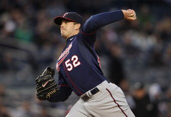 NEW YORK, NY - APRIL 05:  Brian Duensing #52 of the Minnesota Twins pitches against the New York Yankees at Yankee Stadium on April 5, 2011 in the Bronx borough of New York City.  (Photo by Nick Laham/Getty Images)