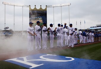 KANSAS CITY, MO - MARCH 31:  Outfielder Alex Gordon #4 of the Kansas City Royals greets teammates during player introductions prior to the start of the opening day game against the Los Angeles Angels of Anaheim at Kauffman Stadium on March 31, 2011 in Kansas City, Missouri.  (Photo by Jamie Squire/Getty Images)