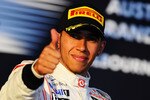 MELBOURNE, AUSTRALIA - MARCH 27:  Lewis Hamilton of Great Britain and McLaren celebrates on the podium after finishing second during the Australian Formula One Grand Prix at the Albert Park Circuit on March 27, 2011 in Melbourne, Australia.  (Photo by Clive Mason/Getty Images)