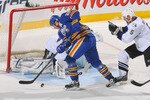 BUFFALO, NY - APRIL 05: Thomas Vanek #26 of the Buffalo Sabres moves the puck just prior to scoring his second goal on Dwayne Roloson #35 of the Tampa Bay Lightning at HSBC Arena on April 5, 2011 in Buffalo, New York.  (Photo by Rick Stewart/Getty Images)