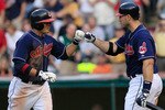 CLEVELAND - MAY 25: Shin-Soo Choo #17 of the Cleveland Indians is congratulated by teammate Travis Hafner #48 after he hit a home run against the Chicago White Sox during the game on May 25, 2010 at Progressive Field in Cleveland, Ohio.  (Photo by Jared Wickerham/Getty Images)