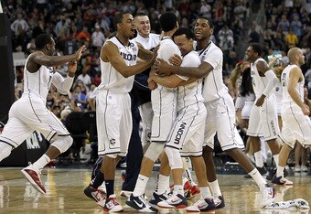 HOUSTON, TX - APRIL 04:  The Connecticut Huskies react after defeating the Butler Bulldogs to win the National Championship Game of the 2011 NCAA Division I Men's Basketball Tournament by a score of 53-41 at Reliant Stadium on April 4, 2011 in Houston, Texas.  (Photo by Ronald Martinez/Getty Images)