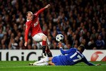 LONDON, ENGLAND - APRIL 06:  Wayne Rooney of Manchester United has his shot on goal blocked by Jose Bosingwa of Chelsea during the UEFA Champions League quarter final first leg match between Chelsea and Manchester United at Stamford Bridge on April 6, 2011 in London, England.  (Photo by Mike Hewitt/Getty Images)