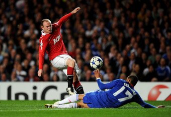 LONDON, ENGLAND - APRIL 06:  Wayne Rooney of Manchester United has his shot on goal blocked by Jose Bosingwa of Chelsea during the UEFA Champions League quarter final first leg match between Chelsea and Manchester United at Stamford Bridge on April 6, 2011 in London, England.  (Photo by Mike Hewitt/Getty Images)
