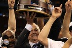 HOUSTON, TX - APRIL 04:  Head coach Jim Calhoun of the Connecticut Huskies celebrate with his team and the trophy after defeating the Butler Bulldogs to win the National Championship Game of the 2011 NCAA Division I Men's Basketball Tournament by a score of 53-41 at Reliant Stadium on April 4, 2011 in Houston, Texas.  (Photo by Streeter Lecka/Getty Images)