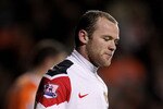 BLACKPOOL, ENGLAND - JANUARY 25:   Wayne Rooney of Manchester United looks on during the Barclays Premier League match between Blackpool and Manchester United at Bloomfield Road on January 25, 2011 in Blackpool, England. (Photo by Alex Livesey/Getty Images)