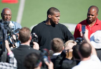 SAN DIEGO, CA - FEBRUARY 10: 2010 Heisman Trophy winning quarterback Cam Newton of Auburn answers questions after his workout routine for the media at Cathedral High School's sports stadium on February 10, 2011 in San Diego, California. (Photo by Kent Horner/ Getty Images)