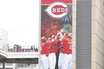 CINCINNATI, OH - MARCH 31: Cincinnati Reds fans pass by the team's divisional championship banner outside the stadium before the opening day game against the Milwaukee Brewers at Great American Ballpark on March 31, 2011 in Cincinnati, Ohio. (Photo by Joe Robbins/Getty Images)