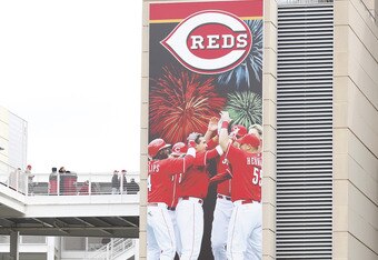 CINCINNATI, OH - MARCH 31: Cincinnati Reds fans pass by the team's divisional championship banner outside the stadium before the opening day game against the Milwaukee Brewers at Great American Ballpark on March 31, 2011 in Cincinnati, Ohio. (Photo by Joe Robbins/Getty Images)