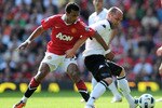 MANCHESTER, ENGLAND - APRIL 09: Nani of Manchester United challenges Danny Murphy of Fulham during the Barclays Premier League match between Manchester United and Fulham at Old Trafford on April 9, 2011 in Manchester, England.  (Photo by Michael Regan/Getty Images)