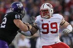 PASADENA, CA - JANUARY 01:  Defensive lineman J.J. Watt #99 of the Wisconsin Badgers rushes the TCU Horned Frogs in the 97th Rose Bowl game on January 1, 2011 in Pasadena, California.  (Photo by Stephen Dunn/Getty Images)