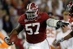 PASADENA, CA - JANUARY 07:  Lineman Marcell Dareus #57 of the Alabama Crimson Tide runs with the ball after an interception against the Texas Longhorns during the second quarter of the Citi BCS National Championship game at the Rose Bowl on January 7, 2010 in Pasadena, California. Dareus would score on the play giving the Crimson Tide a 24-6 lead over the Longhorns.  (Photo by Jeff Gross/Getty Images)