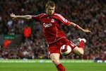 LIVERPOOL, UNITED KINGDOM - APRIL 18:  John Arne Riise of Liverpool shoots at goal during the Barclays Premiership match between Liverpool and Middlesbrough at Anfield on April 18, 2007 in Liverpool, England. (Photo by Alex Livesey/Getty Images)
