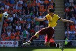 BLACKPOOL, ENGLAND - APRIL 10:  Robin Van Persie of Arsenal strikes the ball during the Barclays Premier League match between Blackpool and Arsenal at Bloomfield Road on April 10, 2011 in Blackpool, England.  (Photo by Alex Livesey/Getty Images)