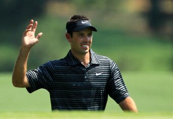 AUGUSTA, GA - APRIL 10:  Charl Schwartzel of South Africa waves to the gallery after holing a shot for eagle on the third green during the final round of the 2011 Masters Tournament on April 10, 2011 in Augusta, Georgia.  (Photo by David Cannon/Getty Images)