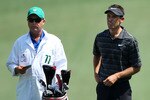 AUGUSTA, GA - APRIL 10:  Charl Schwartzel of South Africa and caddie Greg Hearmon look on from the first hole fairway during the final round of the 2011 Masters Tournament at Augusta National Golf Club on April 10, 2011 in Augusta, Georgia.  (Photo by Andrew Redington/Getty Images)