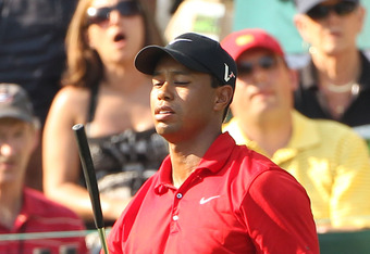 AUGUSTA, GA - APRIL 10:  Tiger Woods reacts to a missed putt on the 16th green during the final round of the 2011 Masters Tournament at Augusta National Golf Club on April 10, 2011 in Augusta, Georgia.  (Photo by Andrew Redington/Getty Images)