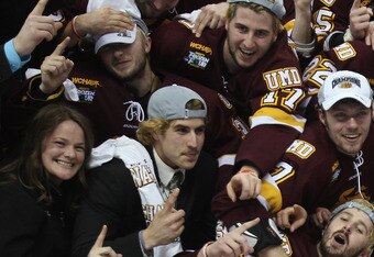 ST. PAUL, MN - APRIL 09:  :  :  The Minnesota Duluth Bulldogs celebrate with the trophy after they defeated the Michigan Wolverines after the championship game of the 2011 NCAA Men's Frozen Four on April 9, 2011 at the Xcel Energy Center in St. Paul, Minnesota. The Minnesota Duluth Bulldogs defeated the Michigan Wolverines 3-2 in overtime.  (Photo by Elsa/Getty Images)
