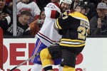 BOSTON, MA - MARCH 24:  Paul Mara #22 of the Montreal Canadiens AND Mark Recchi #28 of the Boston Bruins get in a shoving match as Carey Price #31 stops a shot on March 24, 2011 at the TD Garden in Boston, Massachusetts.  (Photo by Elsa/Getty Images)