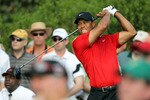 AUGUSTA, GA - APRIL 10:  Tiger Woods hits his tee shot on the 15th hole during the final round of the 2011 Masters Tournament at Augusta National Golf Club on April 10, 2011 in Augusta, Georgia.  (Photo by Jamie Squire/Getty Images)