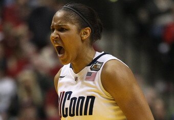 INDIANAPOLIS, IN - APRIL 03:  Maya Moore #23 of the Connecticut Huskies reacts during the semifinals of the 2011 NCAA Women's Final Four on April 3, 2011 at Conseco Fieldhouse in Indianapolis, Indiana. The Texas A&M Aggies defeated the Stanford Cardinal 63-62.  (Photo by Elsa/Getty Images)