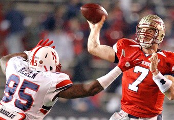 MOBILE, AL - JANUARY 29: Quarterback  Christian Ponder #7 of the South Team passes over defensive lineman Pierre Allen #95 North Team during the fourth quarter of the Under Armour Senior Bowl on January 29, 2011 at Ladd-Pebbles Stadium in Mobile, Alabama.  (Photo by Sean Gardner/Getty Images for Under Armour)