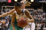 INDIANAPOLIS, IN - APRIL 03:  Maya Moore #23 of the Connecticut Huskies drives around Brittany Mallory #22 of the Notre Dame Fighting Irish during the semifinals of the 2011 NCAA Women's Final Four on April 3, 2011 at Conseco Fieldhouse in Indianapolis, Indiana. The Notre Dame Fighting Irish defeated the Connecticut Huskies 72-63.  (Photo by Elsa/Getty Images)