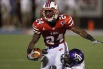 DALLAS - SEPTEMBER 24:  Wide receiver Aldrick Robinson #24 of the SMU Mustangs is tackled by Greg McCoy #7 of the TCU Horned Frogs at Gerald J. Ford Stadium on September 24, 2010 in Dallas, Texas.  (Photo by Ronald Martinez/Getty Images)