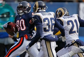 CHICAGO - DECEMBER 06:  Earl Bennett #80 of the Chicago Bears breaks for a long run and is chased by (L-R) Oshiomogho Atogwe #21 of the St. Louis Rams at Soldier Field on December 6, 2009 in Chicago, Illinois. The Bears defeated the Rams 17-9. (Photo by Jonathan Daniel/Getty Images)