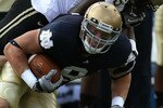SOUTH BEND, IN - SEPTEMBER 04: Kyle Rudolph #9 of the Notre Dame Fighting Irish is tackled by Charlton Williams #15 of the Purdue Boilermakers at Notre Dame Stadium on September 4, 2010 in South Bend, Indiana. Notre Dame defeated Purdue 23-12. (Photo by Jonathan Daniel/Getty Images)