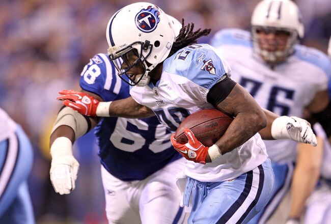 INDIANAPOLIS - JANUARY 02:  Chris Johnson #28 of the Tennessee Titans is tackled by Eric Foster #68 of the Indianapolis Colts at Lucas Oil Stadium on January 2, 2011 in Indianapolis, Indiana.  the Colts won 23-20.  (Photo by Andy Lyons/Getty Images)
