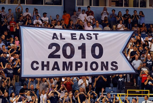ST. PETERSBURG, FL - APRIL 01:  The Tampa Bay Rays raise their 2010 American League East championship banner just before the start of the Opening Day game against the Baltimore Orioles at Tropicana Field on April 1, 2011 in St. Petersburg, Florida.  (Photo by J. Meric/Getty Images)